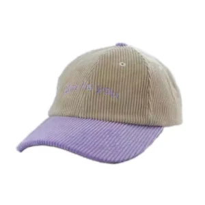 Corduroy custom dad hat in beige and purple with embroidered logo.