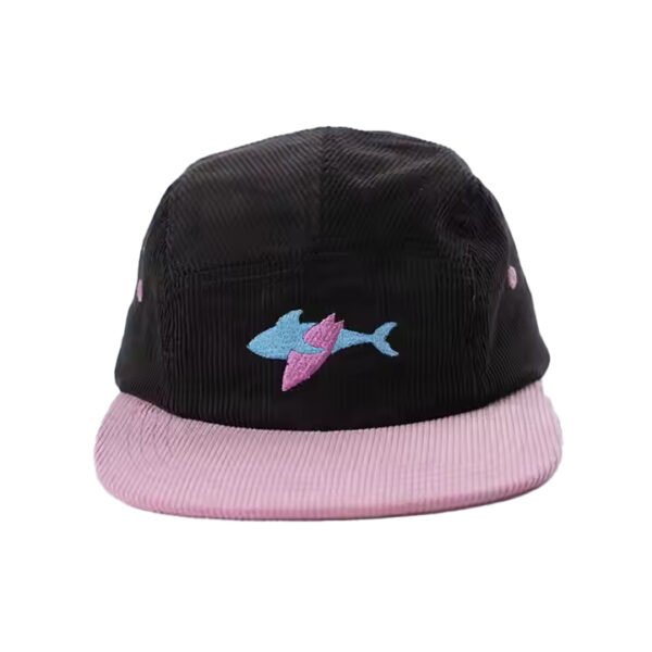 Custom five panel hat in black corduroy with pink brim and embroidered shark logo.