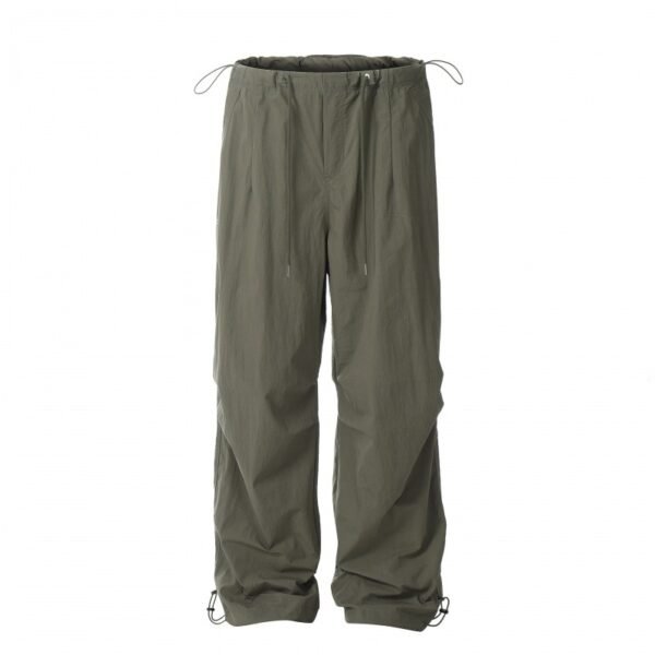 Dark green lightweight traveler pants for men and women with adjustable drawstrings