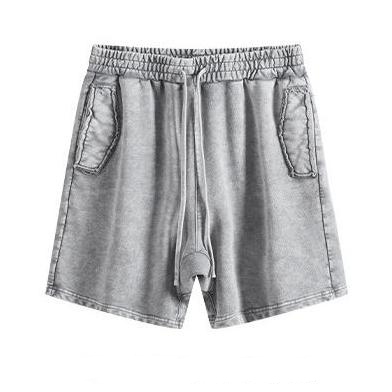 Distressed grey hot shorts in cotton with washed finish and raw edge pockets