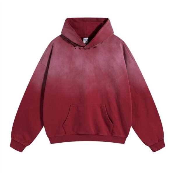 Next level hoodie in vintage washed red with distressed details and hooded design.