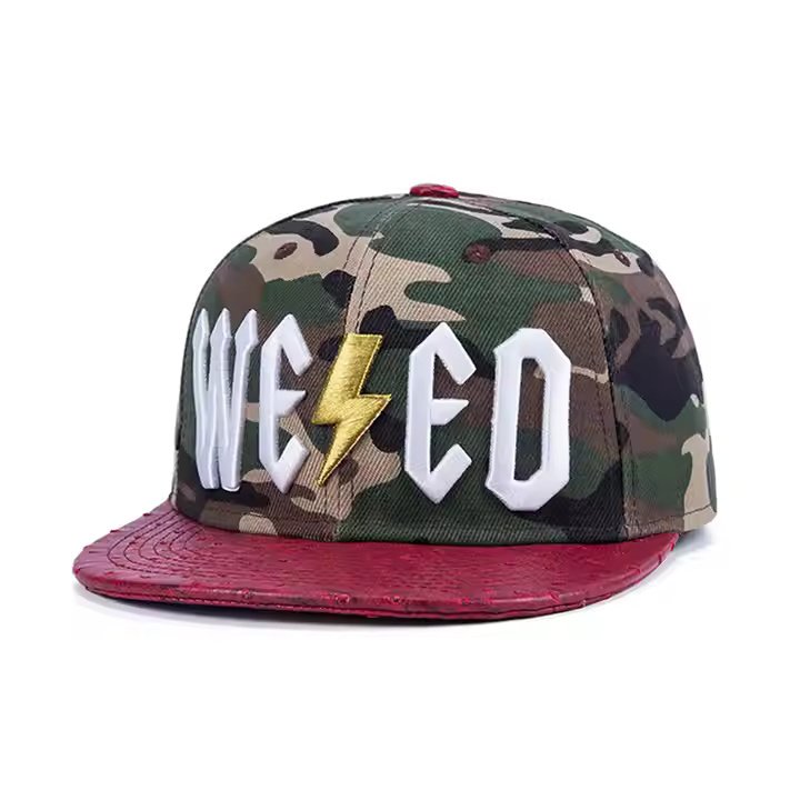 Performance snapback hat with camo crown, red faux leather brim, and 3D embroidered logo
